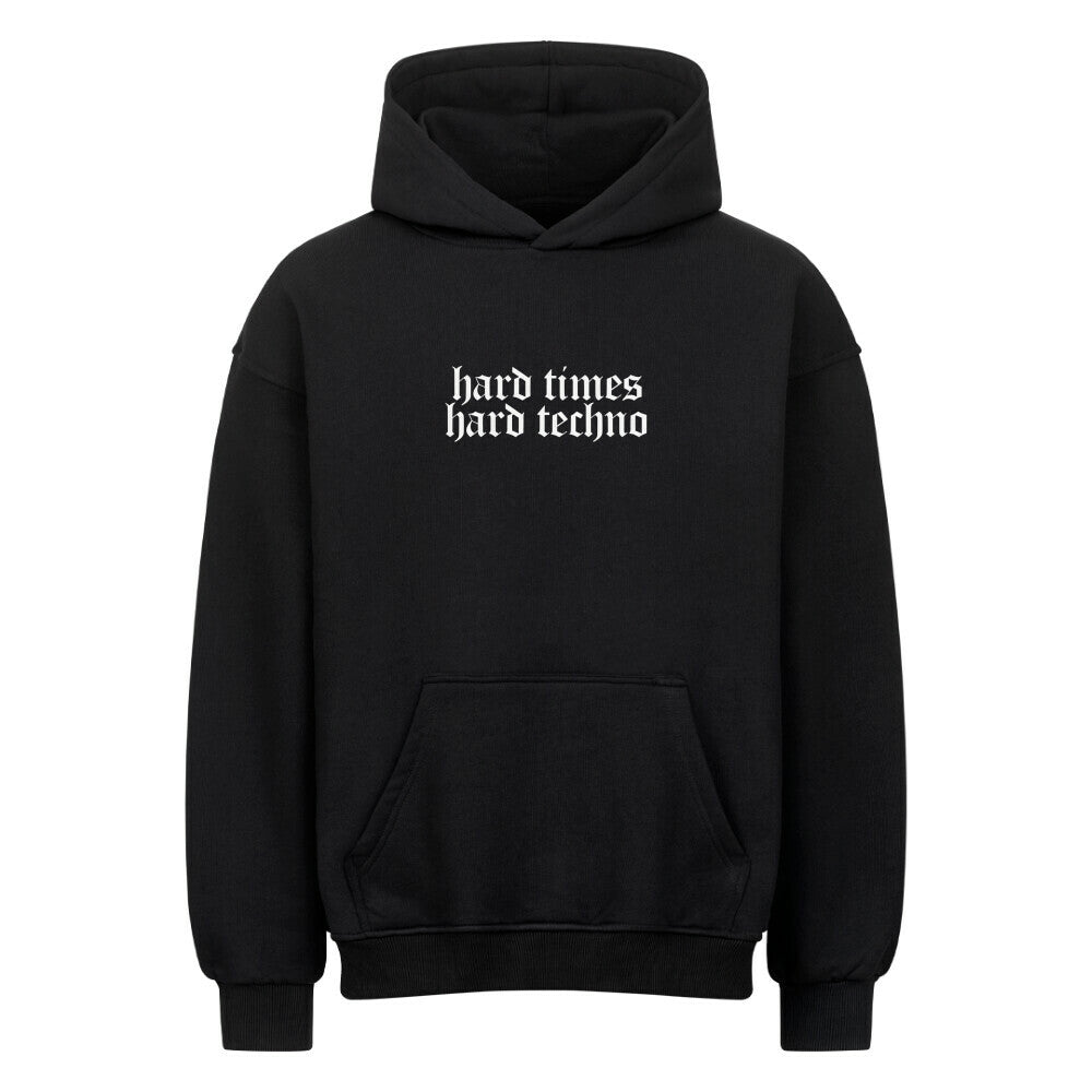 Black oversized hoodie with "hard times hard techno" text, heavy cotton blend, brushed interior and exterior, drop shoulders, no drawstring hood.