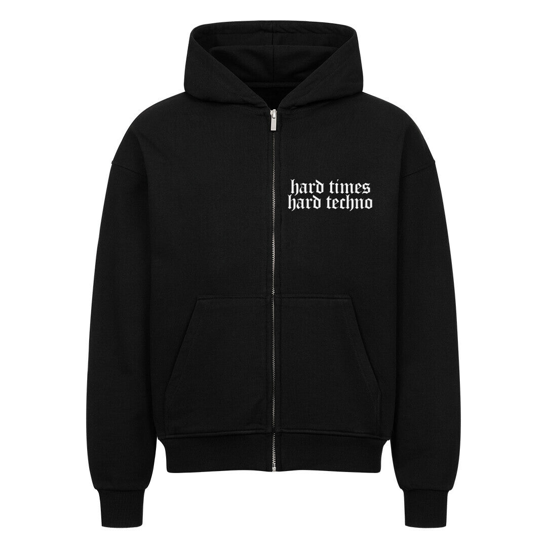 Black oversized zipper hoodie with "hard times hard techno" white text, large hood, and front pockets