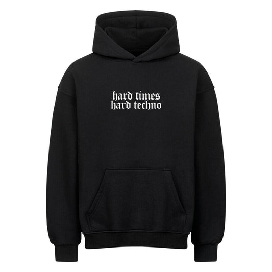 Black oversized hoodie with "hard times hard techno" text, heavy cotton blend, brushed interior and exterior, drop shoulders, no drawstring hood.